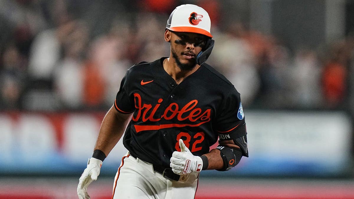 Baltimore Orioles' Jeremiah Jackson rounding bases after hitting home run.