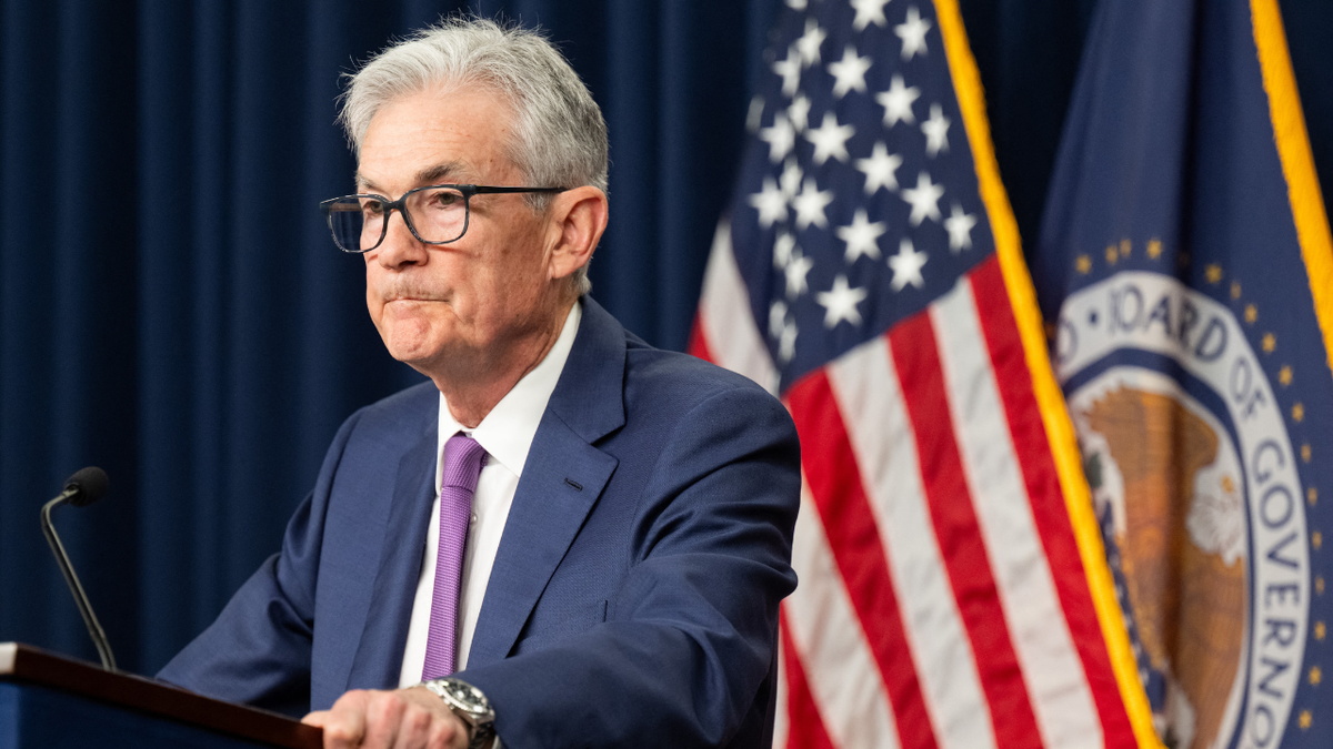 Federal Reserve Chair Chair Jerome Powell listens to a question from a reporter.