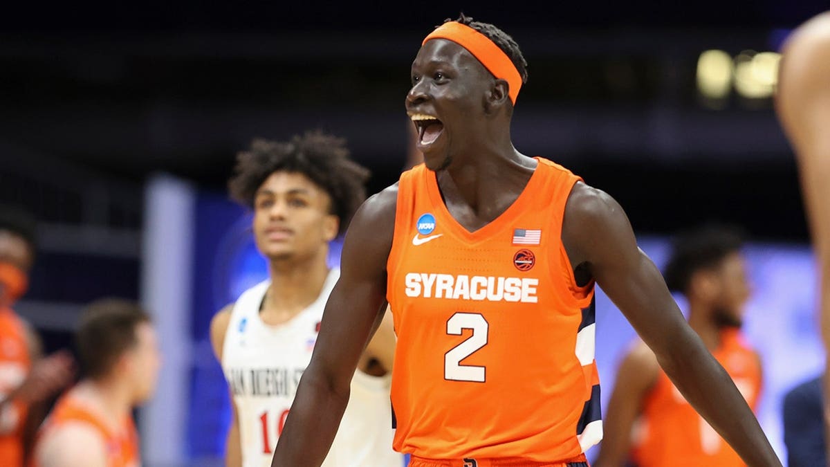 John Bol Ajak celebrating on basketball court at Hinkle Fieldhouse