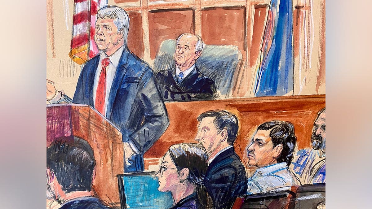 Justice Department prosecutor John Gibbs speaking in courtroom with defense attorneys Lauren Rosen and Geremy Kamens, defendant Mohammad Sharifullah, interpreter, and Judge Anthony John Trenga listening