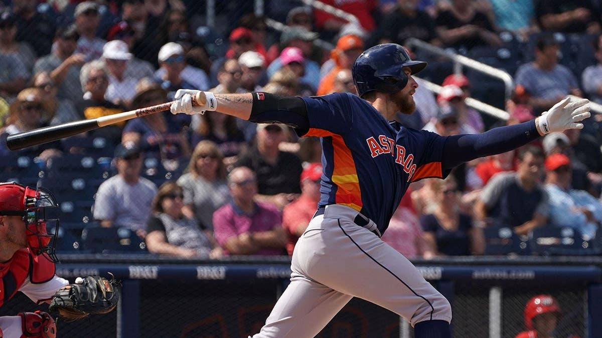 Houston Astros left fielder Jon Kemmer singles during spring training game