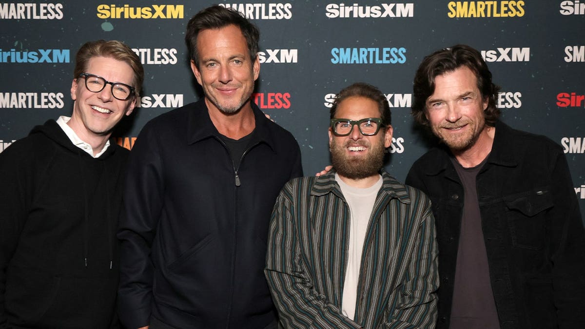Jonah Hill with Smartless podcast hosts