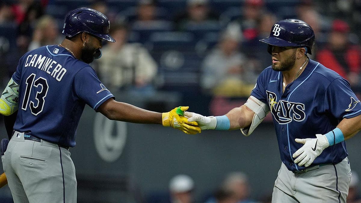 Tampa Bay Rays' Jonathan Aranda being congratulated by Junior Caminero after a home run.
