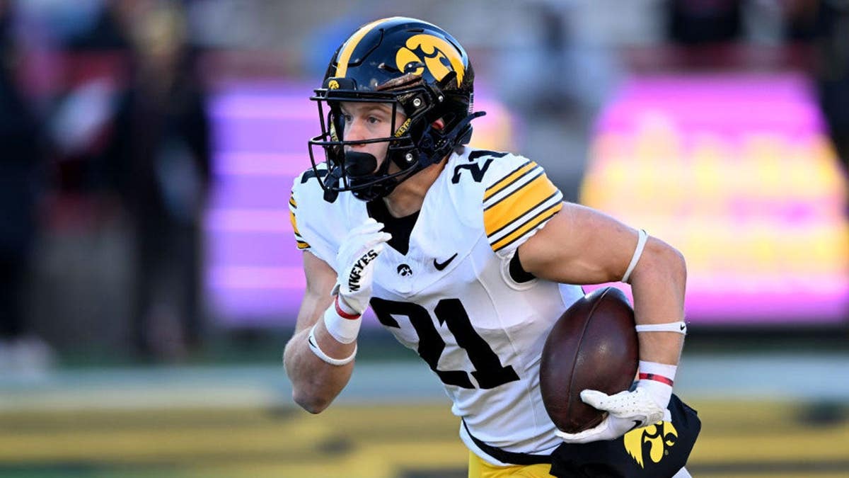 Kaden Wetjen of the Iowa Hawkeyes returns the ball at Maryland Stadium