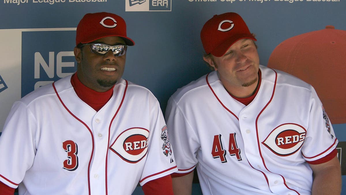 Ken Griffey Jr. and Adam Dunn is waiting to bat on the baseball field