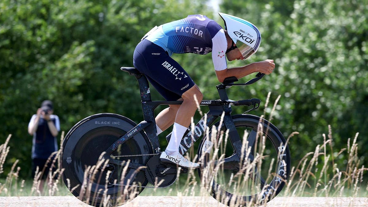 Kiaan Watts cycling during an individual time trial in Ham, Belgium