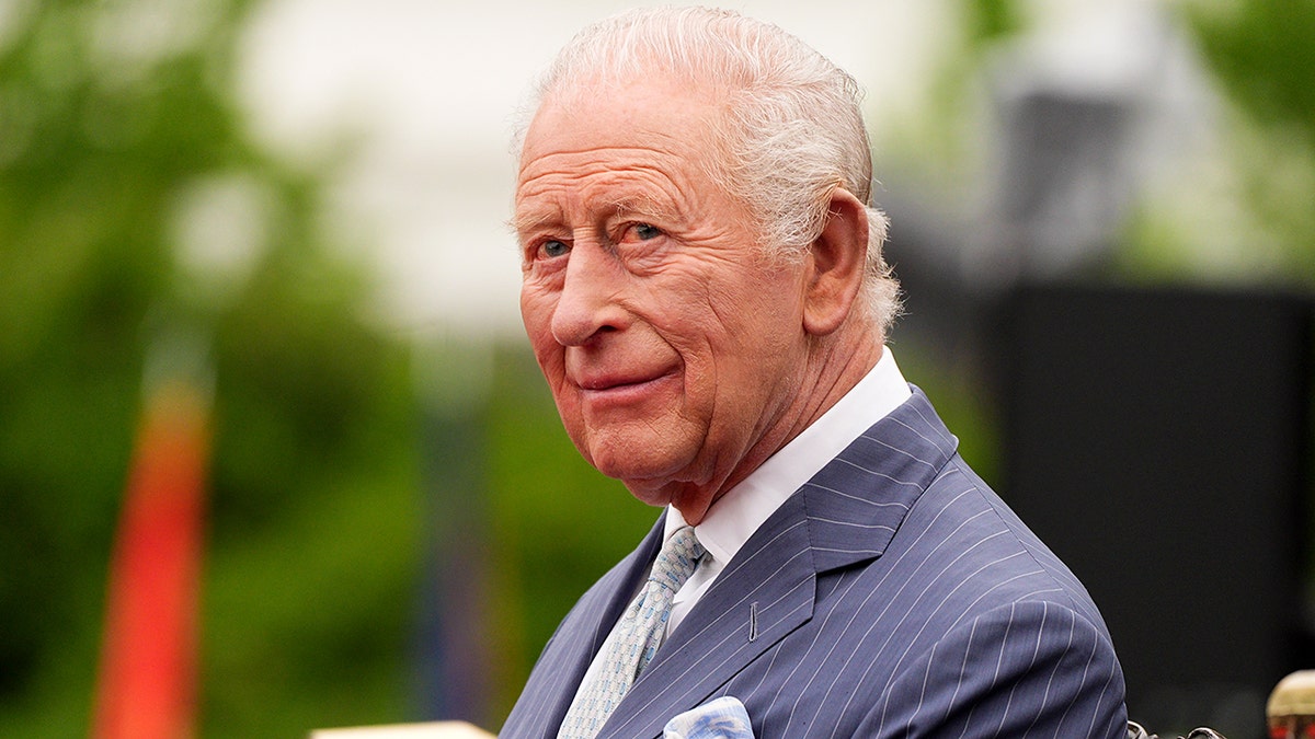 King Charles III listens to President Donald Trump on the South Lawn of the White House
