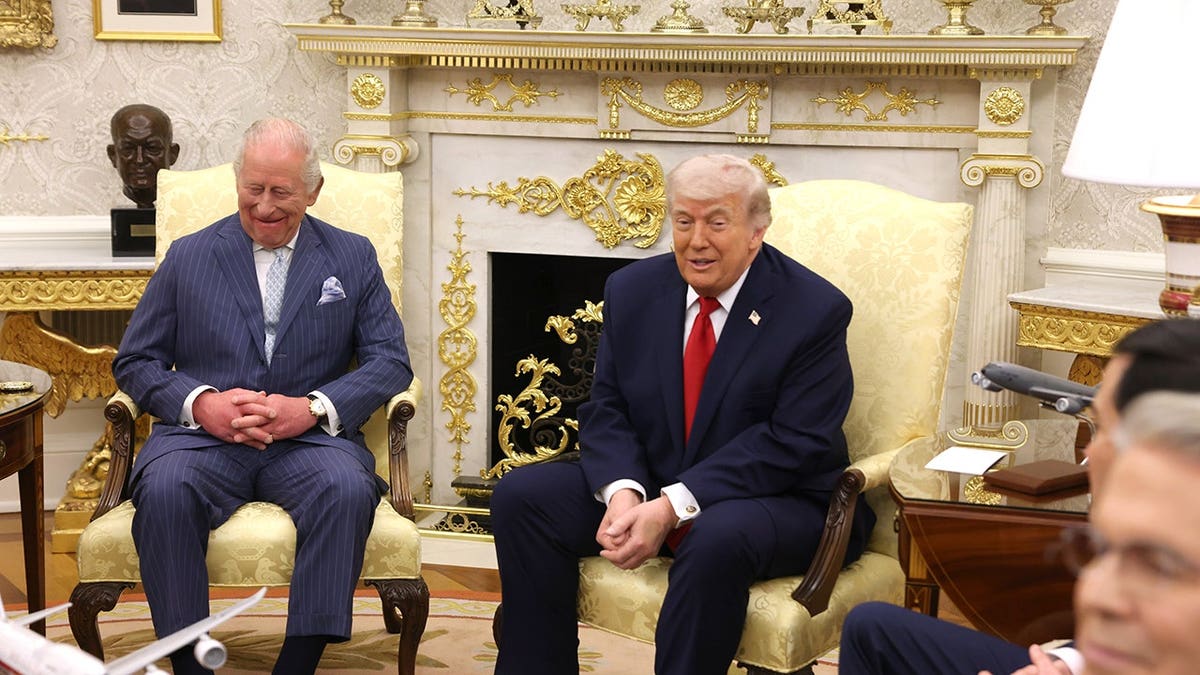 King Charles III and President Donald Trump seated in the Oval Office of the White House