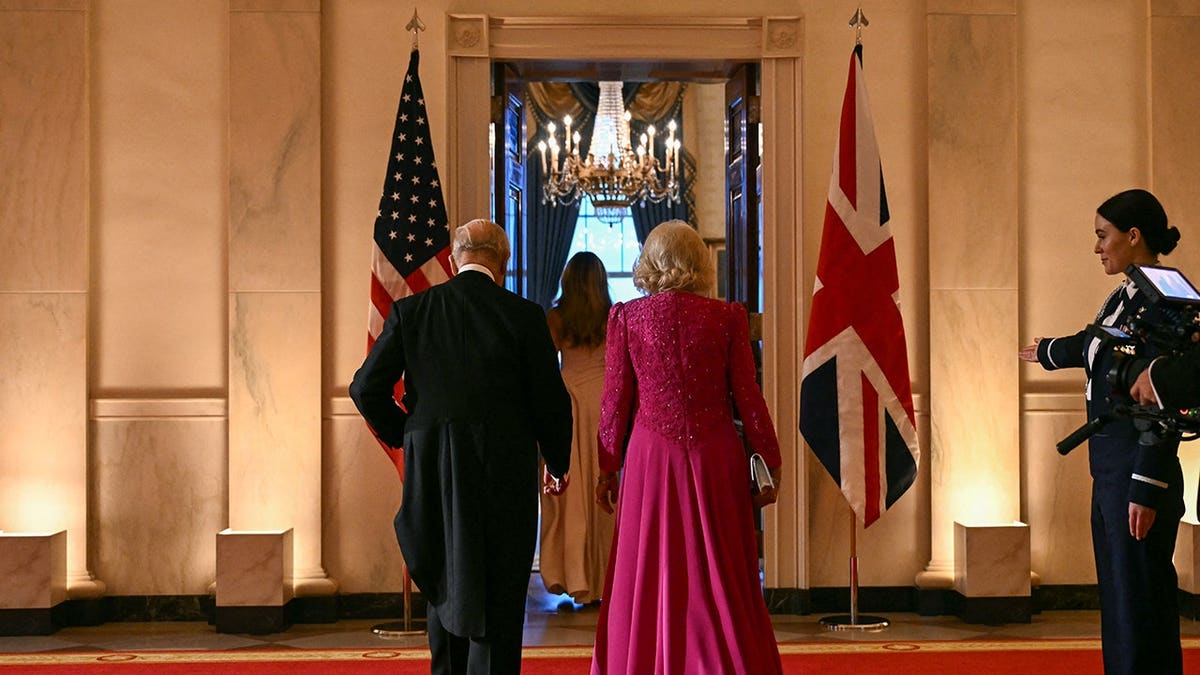 King Charles III and Queen Camilla arriving at the White House East Room