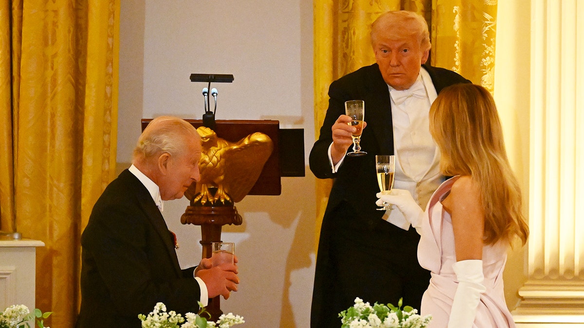 King Charles, President Trump and first lady Melania Trump toasting.