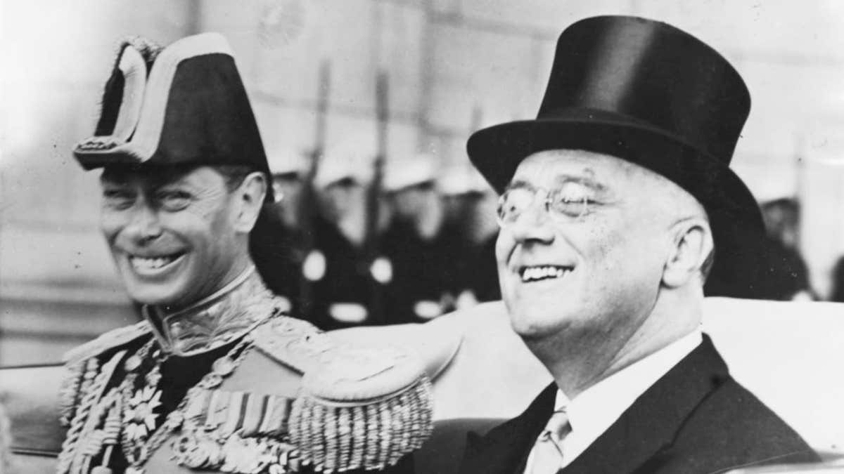President Franklin D Roosevelt and King George VI riding in an open carriage.