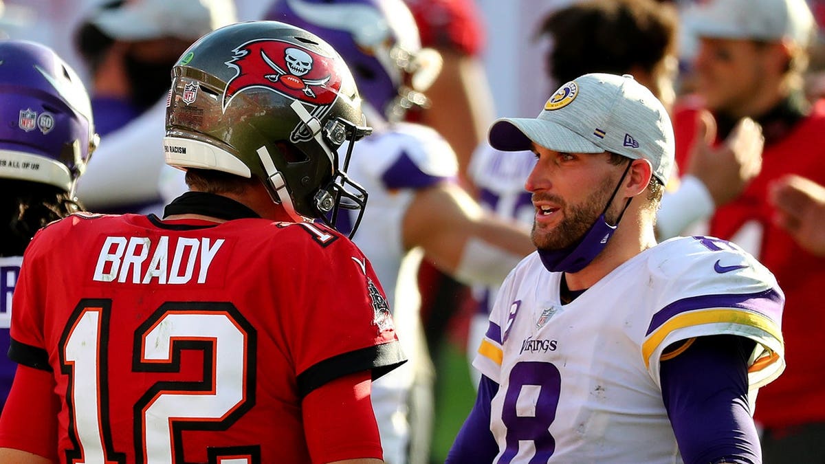 Minnesota Vikings quarterback Kirk Cousins and Tampa Bay Buccaneers quarterback Tom Brady greeting at Raymond James Stadium
