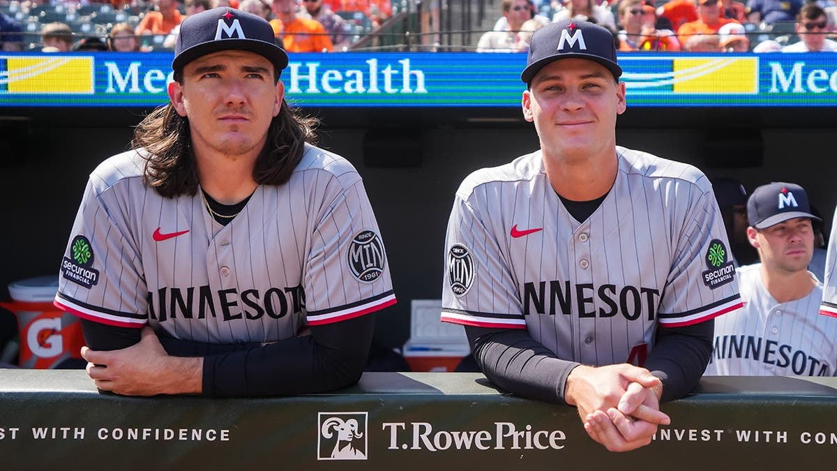 Kody Funderburk and Cole Sands standing on the field at Oriole Park at Camden Yards.