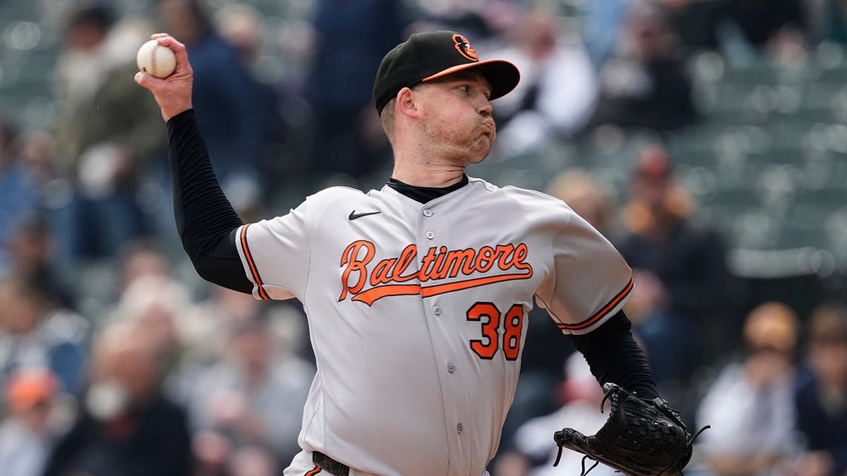 Baltimore Orioles pitcher Kyle Bradish throwing a pitch during a baseball game in Chicago