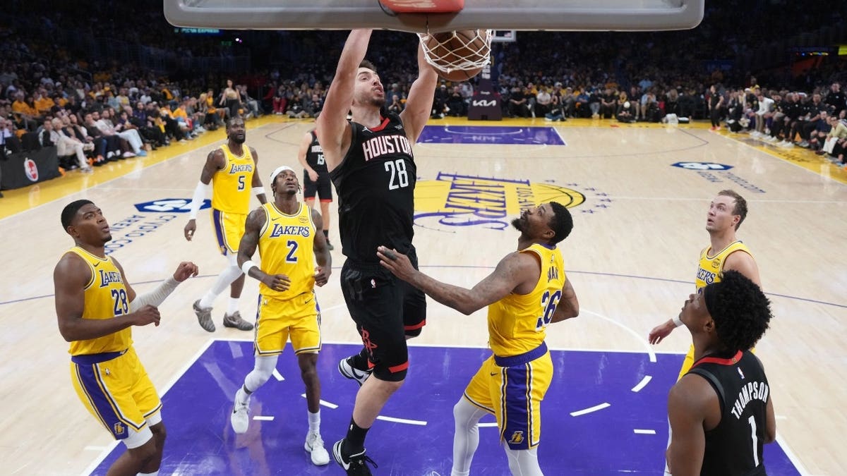 Houston Rockets center Alperen Sengun dunks the ball on the Los Angeles Lakers in Game 1 of the first round of the 2026 NBA Playoffs at Crypto.com Arena.