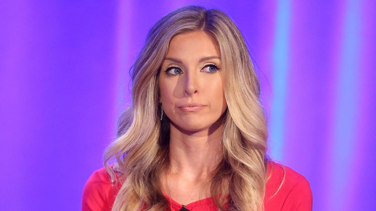 TV personality Lindsie Chrisley speaking onstage at a panel event