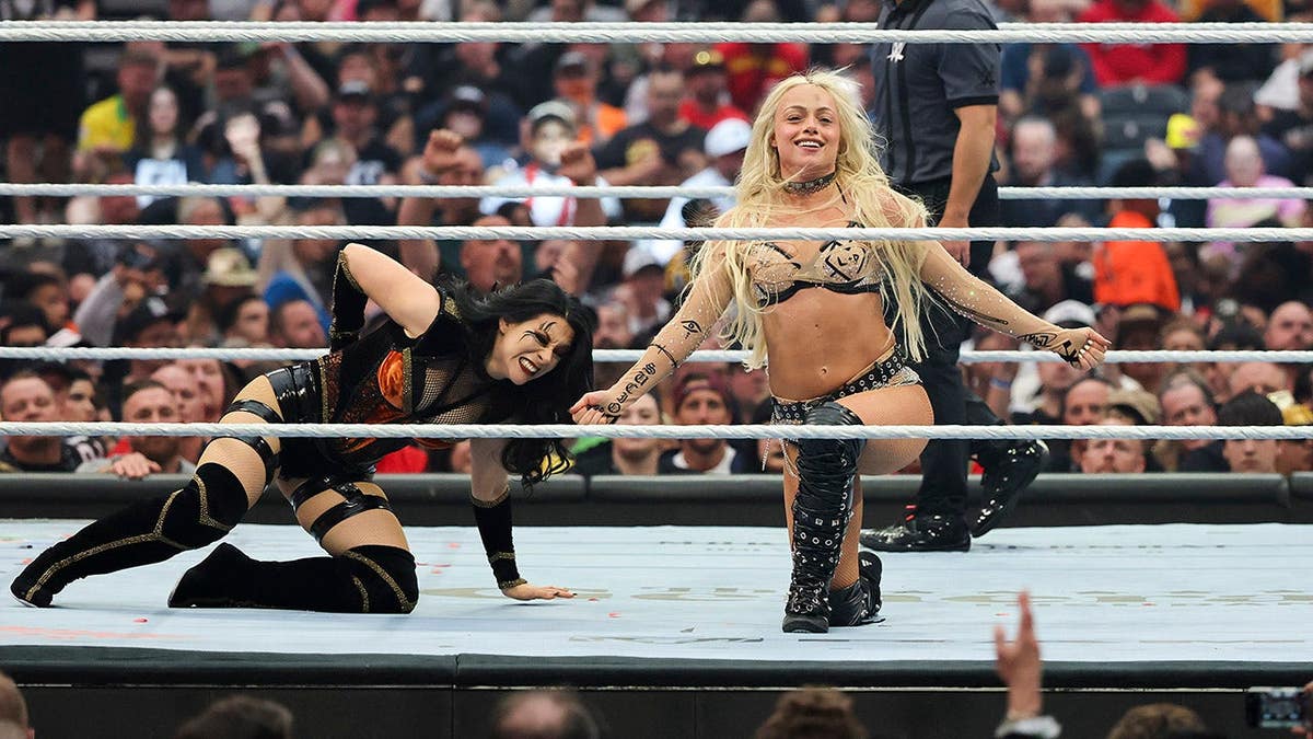 Liv Morgan kicking Stephanie Vaquer during a wrestling match at Allegiant Stadium
