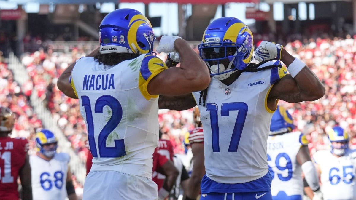Los Angeles Rams WRs Puka Nacua and Davante Adams flex after a touchdown against the San Francisco 49ers at Levi's Stadium.