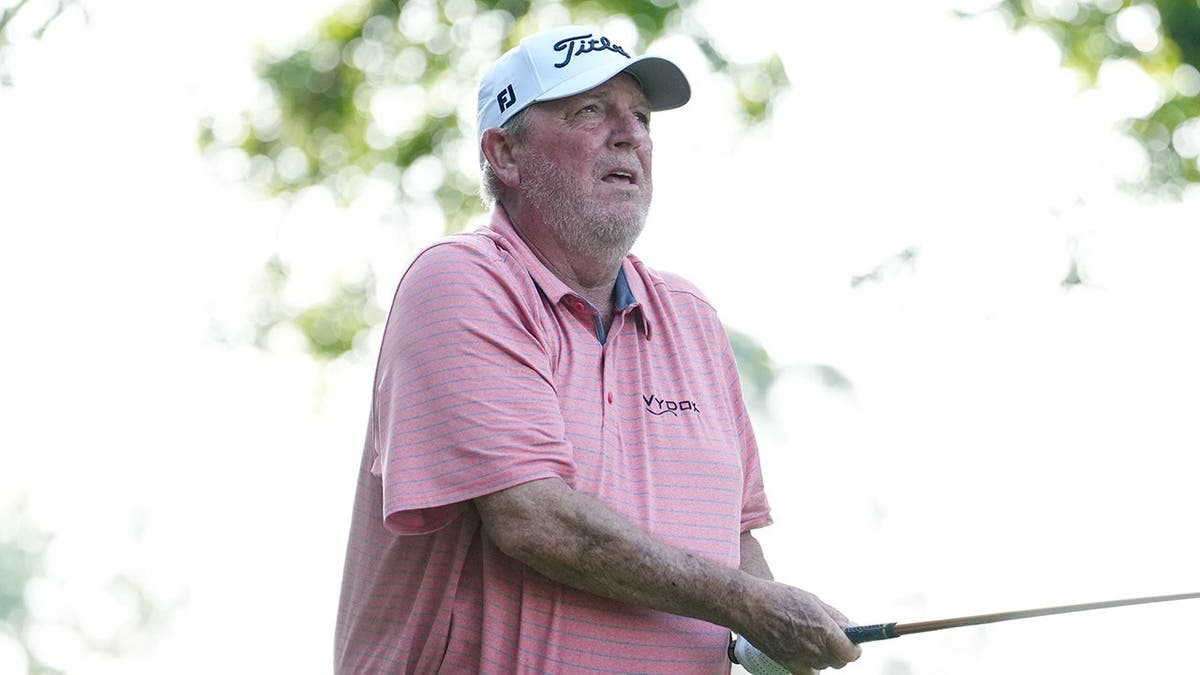 Mark Calcavecchia playing a golf shot from the ninth tee at The Woodlands Golf Club