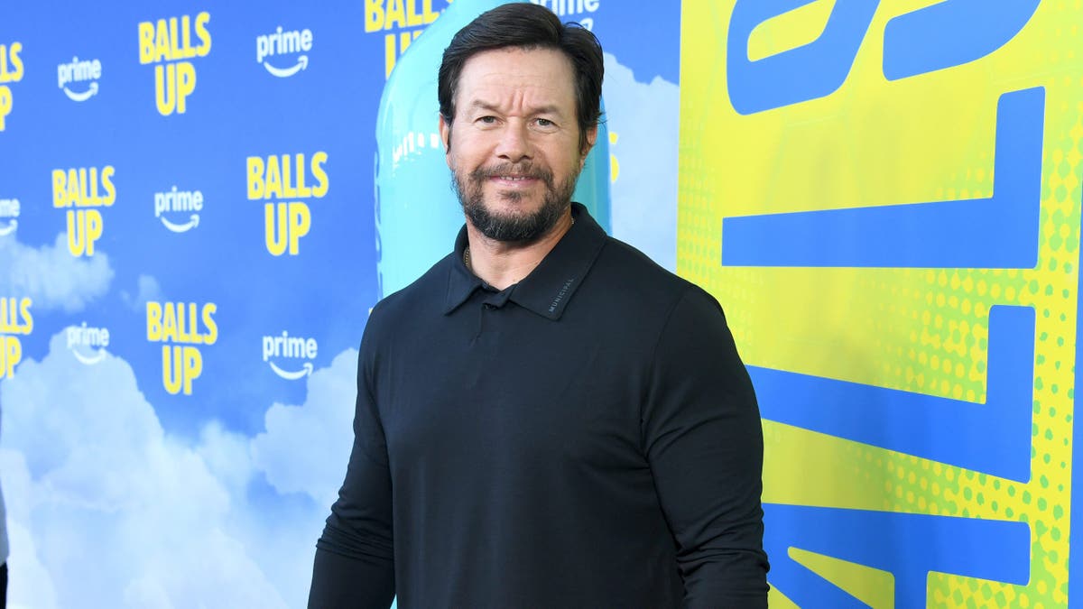 Mark Wahlberg poses at the premiere of his new movie, "Balls Up."