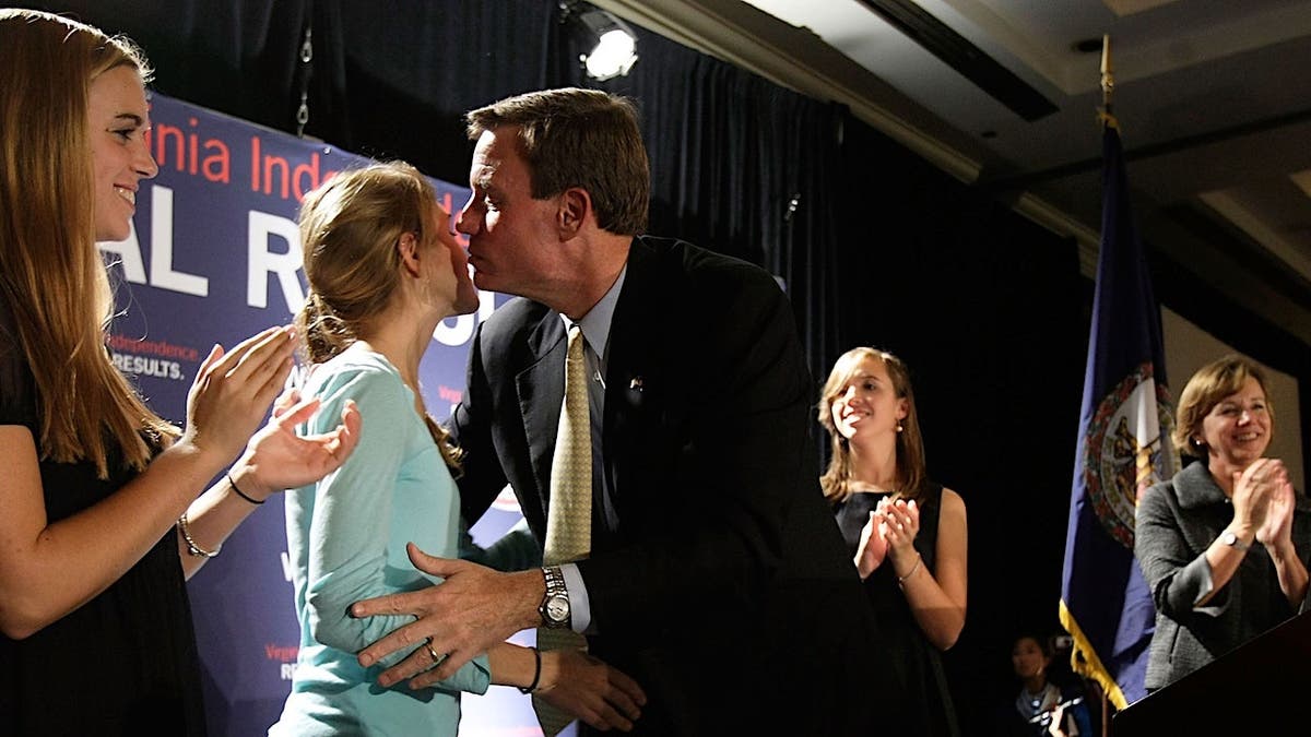 Mark Warner kissing his daughter Madison at an election night party in McLean, Virginia