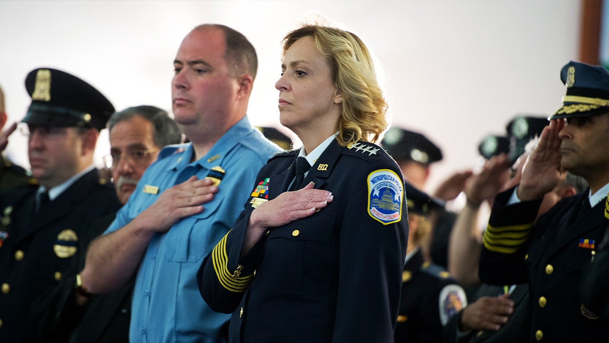 Police officers Matthew Mahl and Cathy Lanier attending an event.