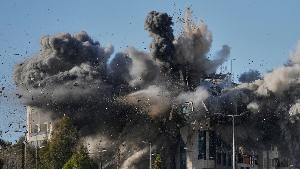 Smoke rising from a building hit by an Israeli airstrike near airport road in Beirut Lebanon