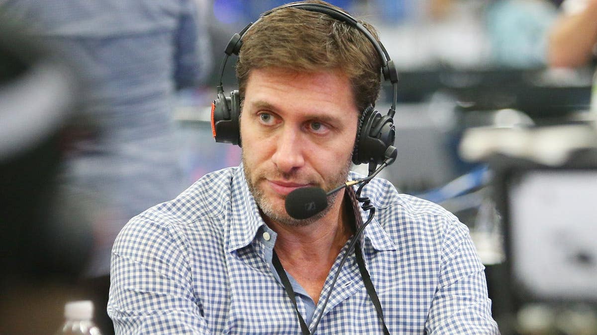 ESPN personality Mike Greenberg being interviewed on radio row at a convention center