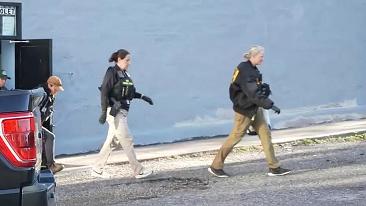 Agents walking out of a building