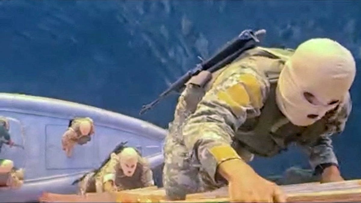Iranian soldiers participating in the seizure of container ships MSC Francesca and Epaminondas in the Strait of Hormuz