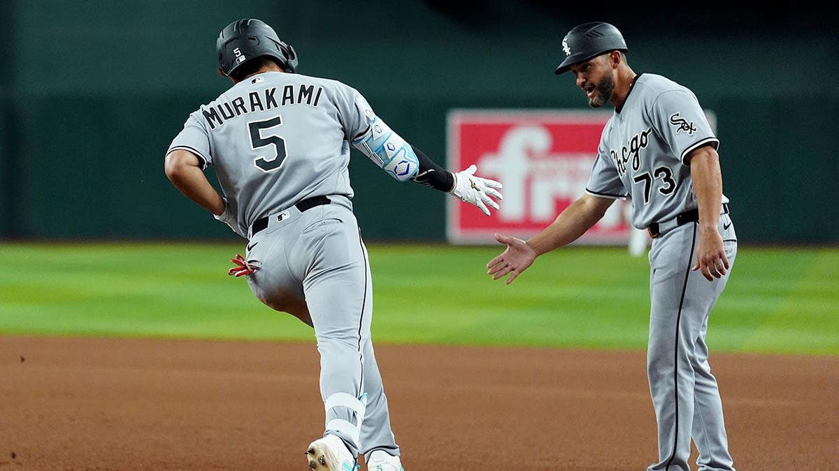 Munetaka Murakami celebrating home run with Jose Leger during baseball game in Phoenix