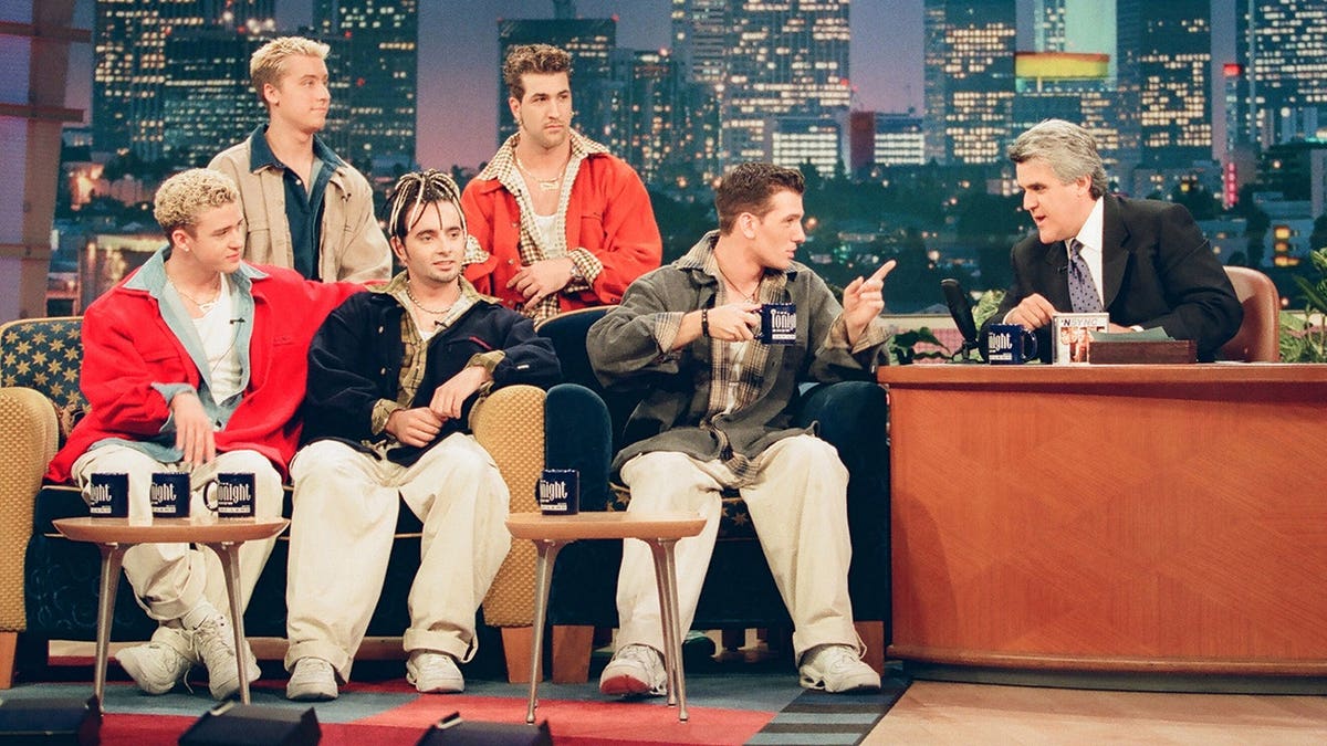 Justin Timberlake, Lance Bass, Chris Kirkpatrick, Joey Fatone, JC Chasez seated with Jay Leno during interview