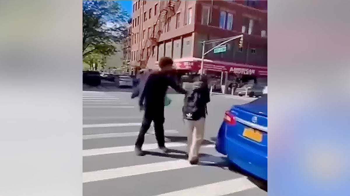 Boy confronting girls on the street
