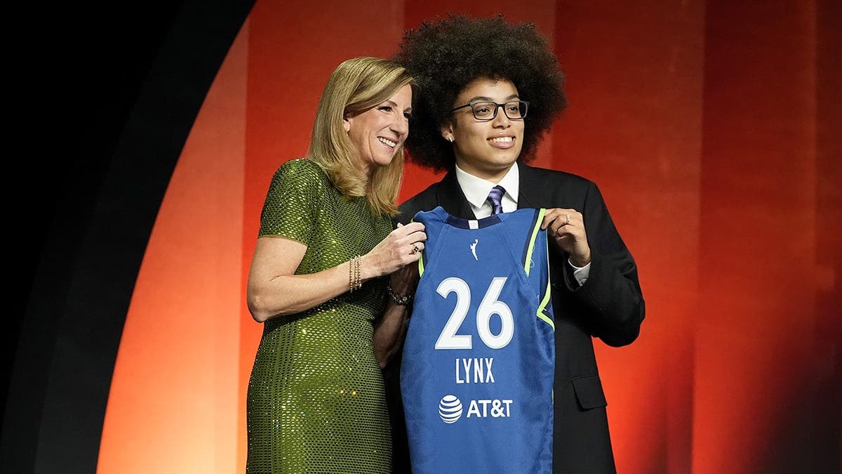 Olivia Miles posing with WNBA Commissioner Cathy Engelbert after being drafted by Minnesota Lynx