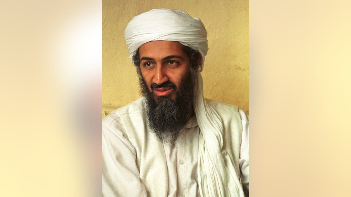 Saudi dissident Osama bin Laden standing and looking forward
