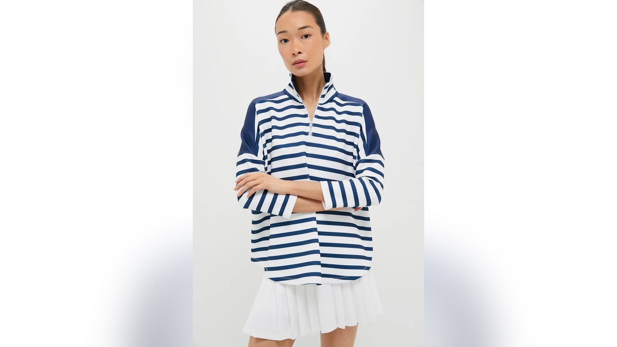 Hit the course or the court in this sporty zip-up. 