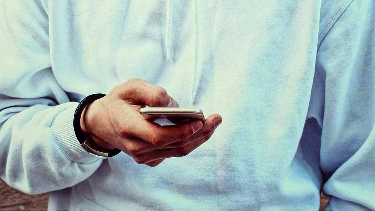 A person scrolling on their phone