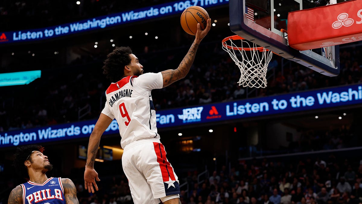 A Washington Wizards player attempts a layup at the basket