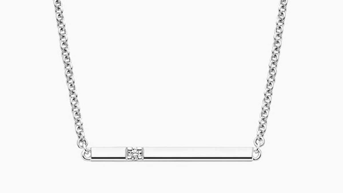 This necklace pairs a diamond with silver for an eye-catching finish. 