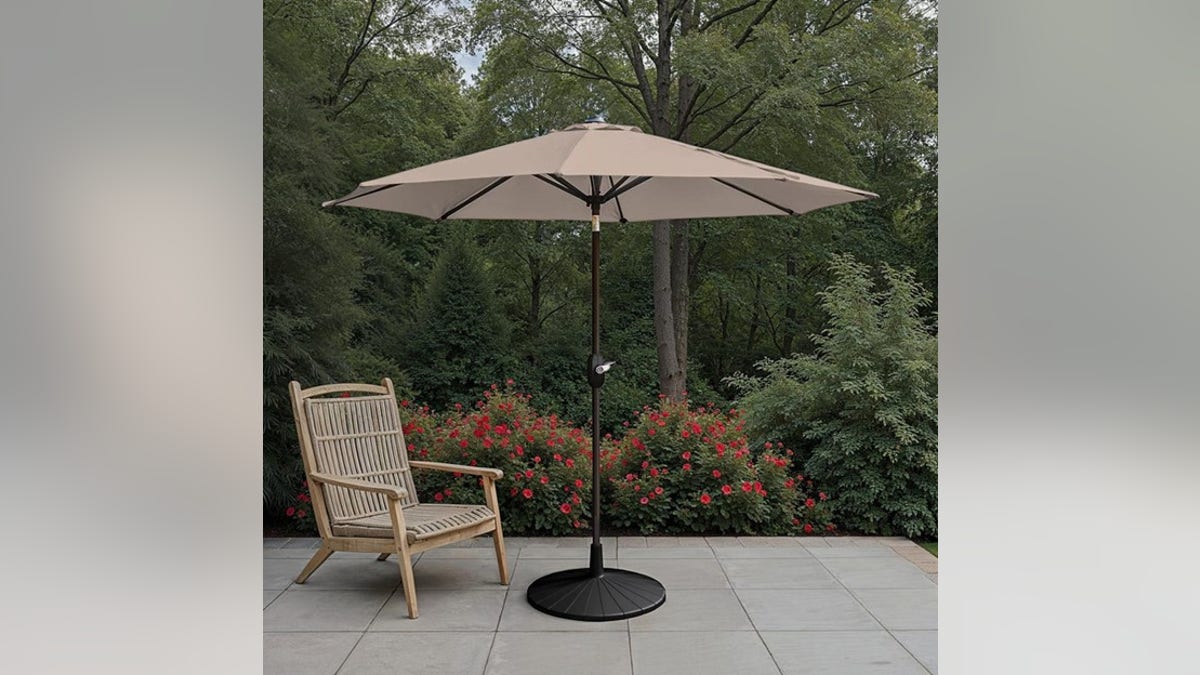 Stay safe from the sun under this tilting umbrella. 