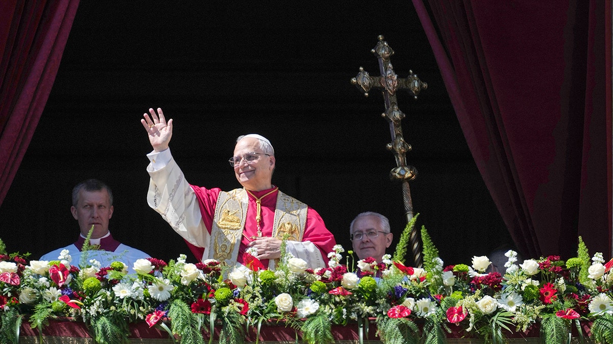Pope Leo XIV delivering the Urbi et Orbi blessing from the central loggia of St. Peter's Basilica.