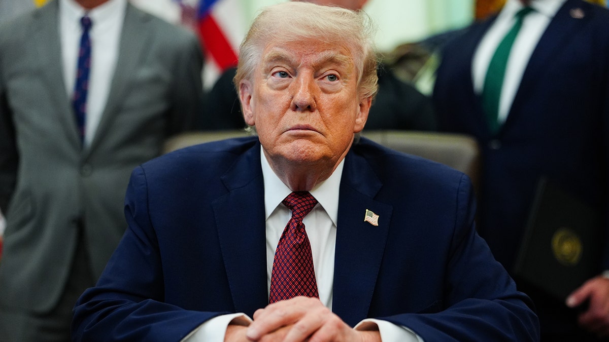 Donald Trump listens successful  Oval Office of White House