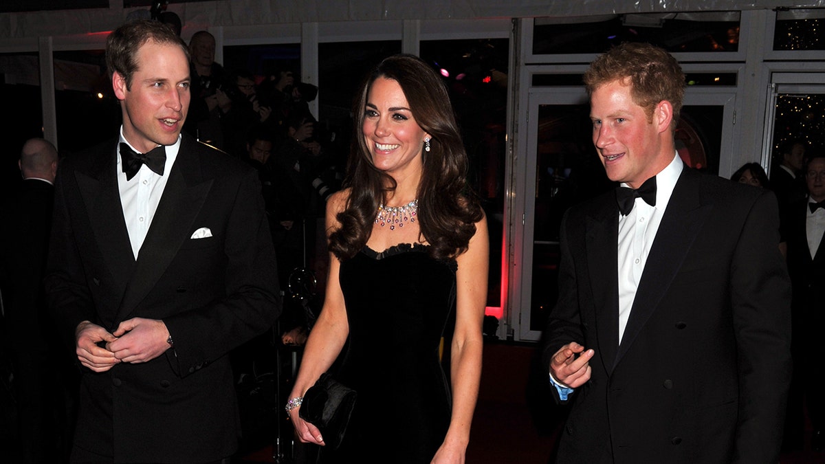 Prince Harry with Prince William and Kate Middleton in formal wear during a night out.