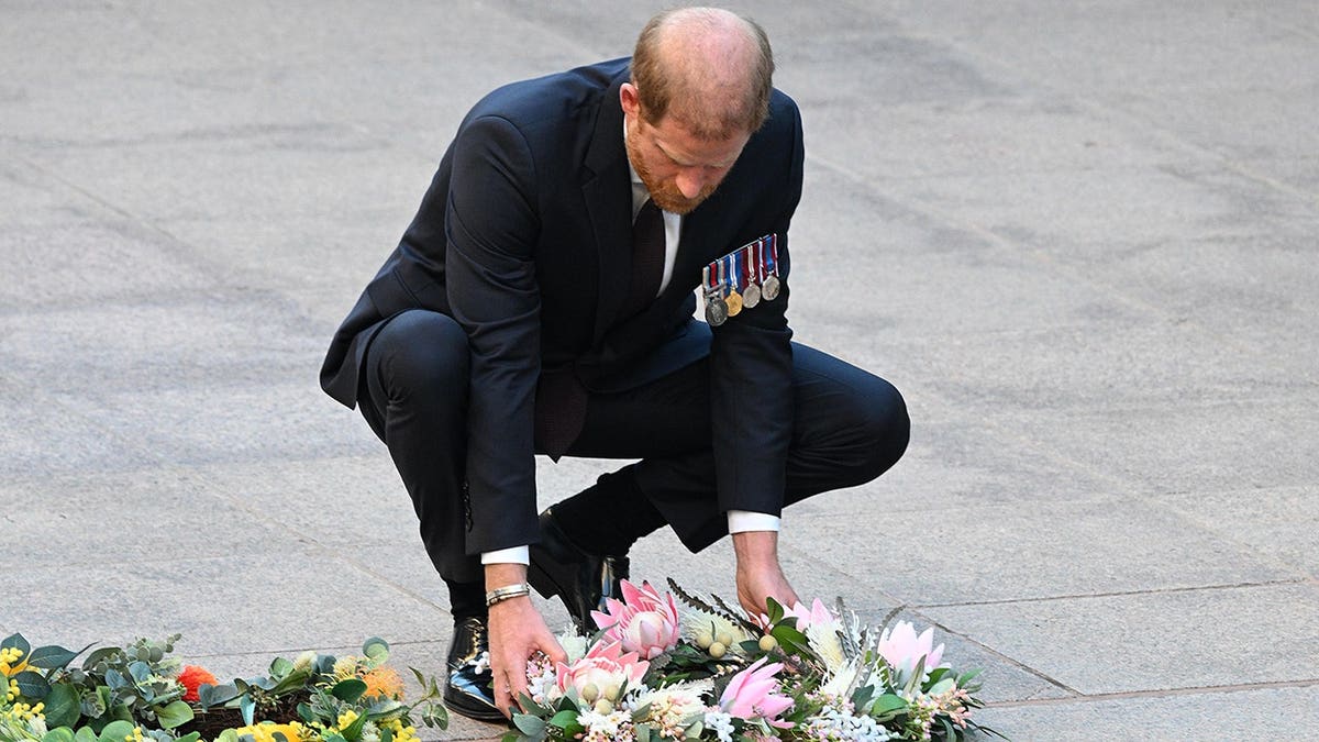 Prince Harry lays a wreath at the Australian War Memorial in Canberra