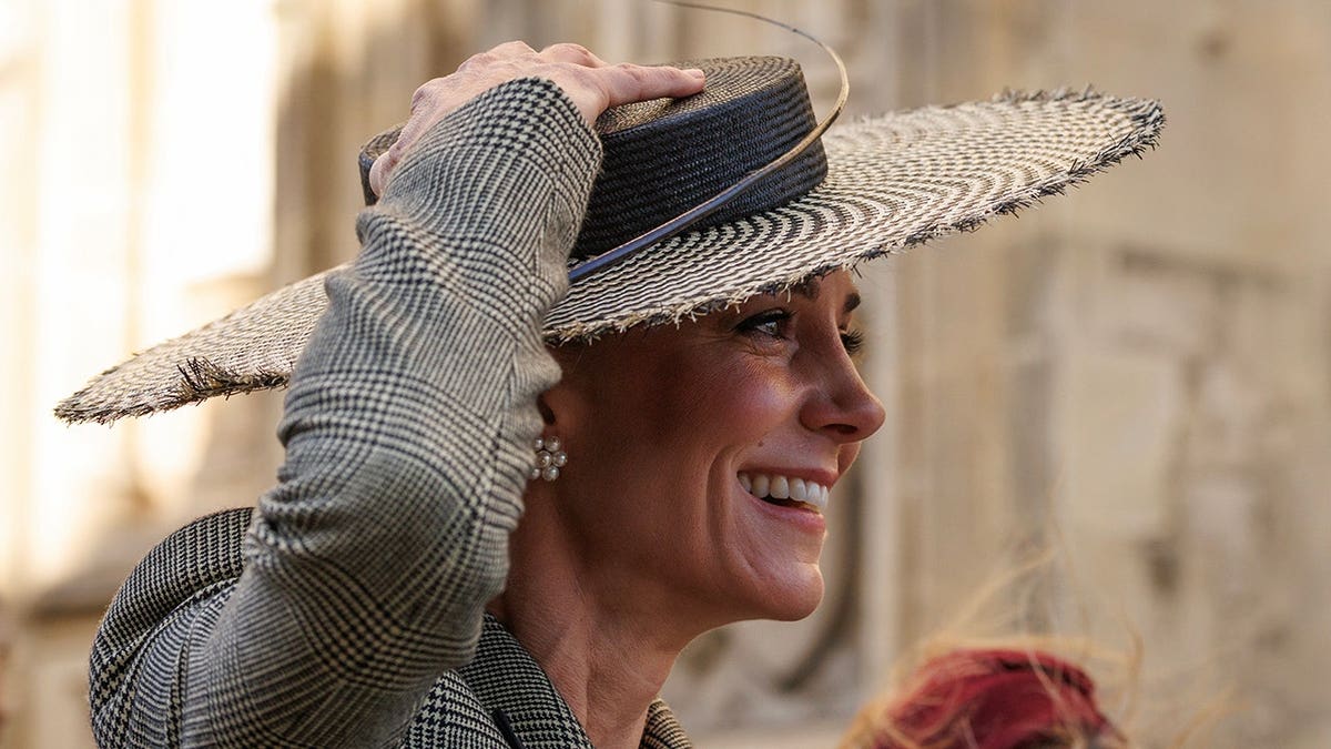 Catherine Princess of Wales holding her hat outside Canterbury Cathedral