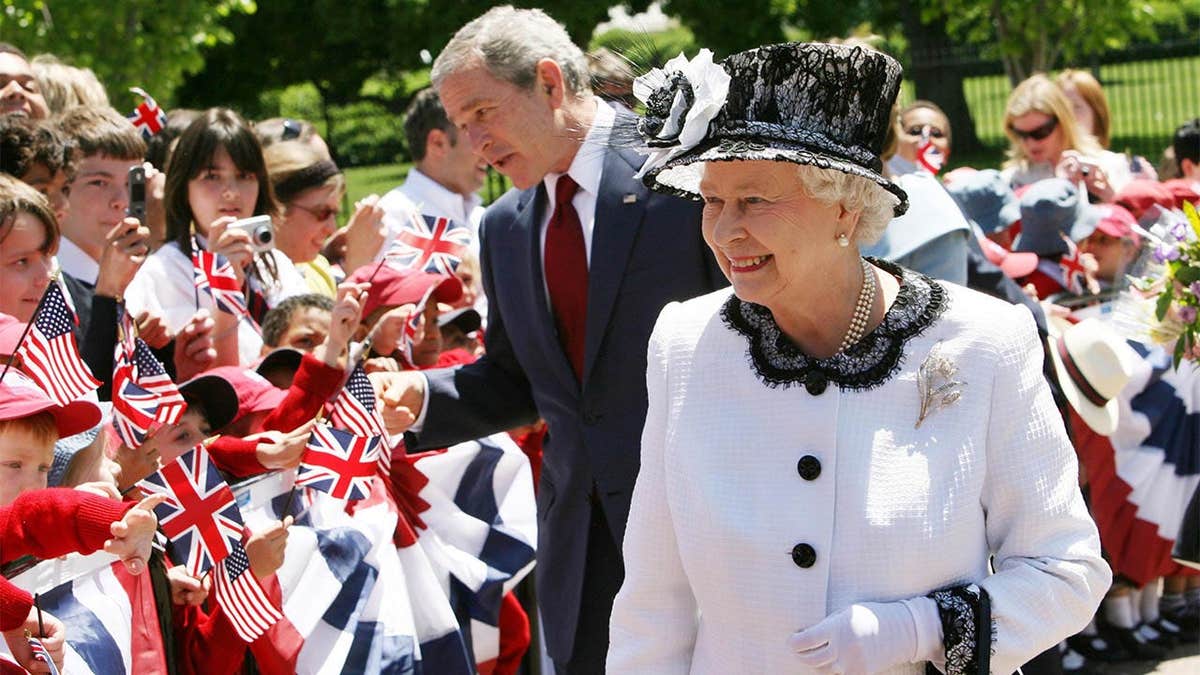 Queen Elizabeth II and President George Bush walking to Blair House in Washington DC