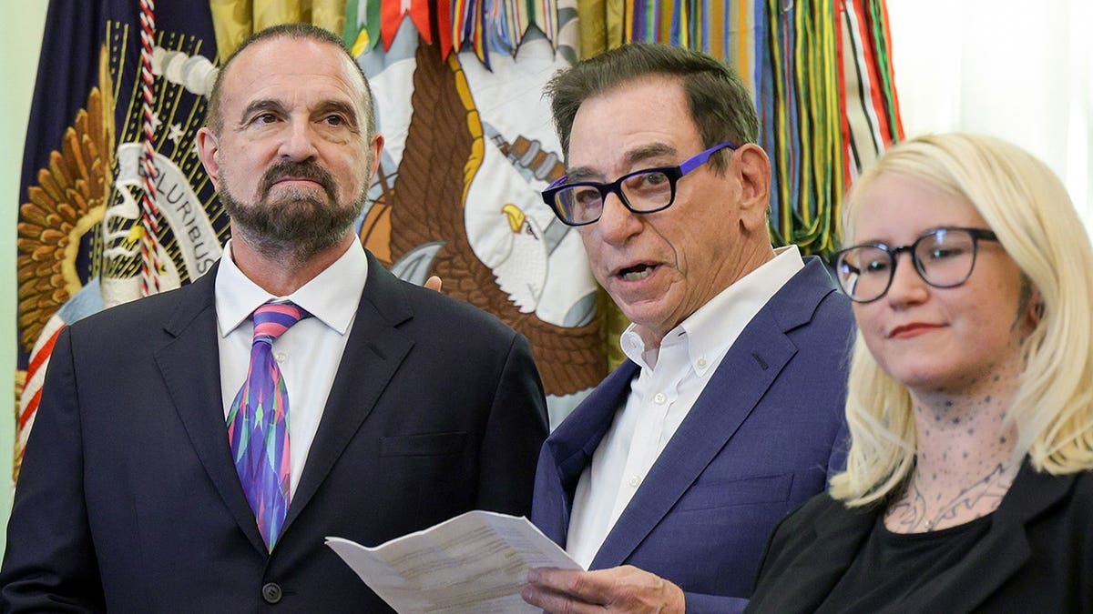 CEO of Regeneron Pharmaceuticals Leonard Schleifer (C) and President, Chief Scientific Officer of Regeneron Pharmaceuticals George Yancopoulos, and Travis Smith's mother Sierra