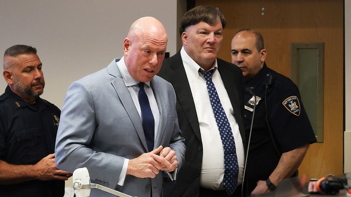 Rex A. Heuermann standing in Suffolk County Court during guilty plea hearing