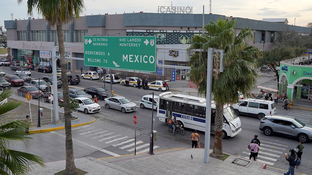 Vehicles driving on a road near the international bridge in Reynosa Mexico