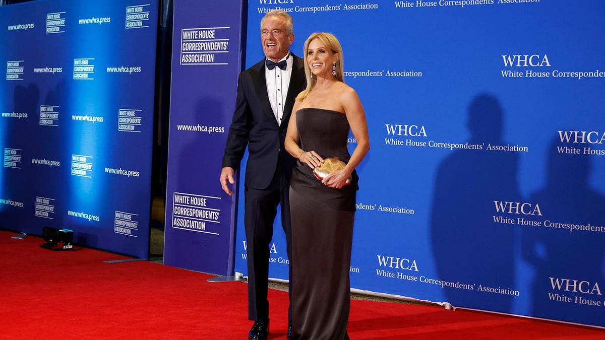US Secretary of Health and Human Services Robert F. Kennedy Jr. and Cheryl Hines standing together at the White House Correspondents' Dinner
